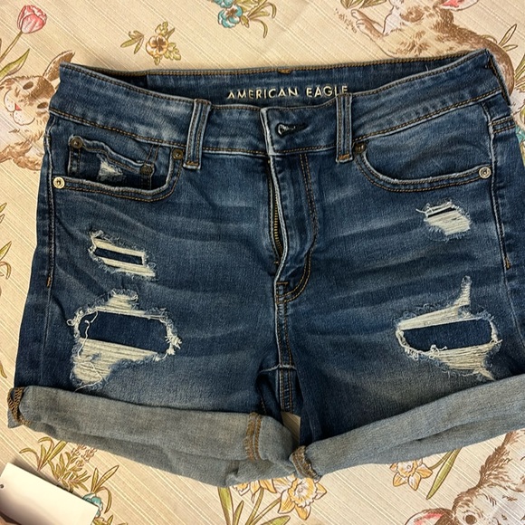 American Eagle Outfitters Pants - Size 8 American Eagle rolled stretch denim shorts with frayed patches.